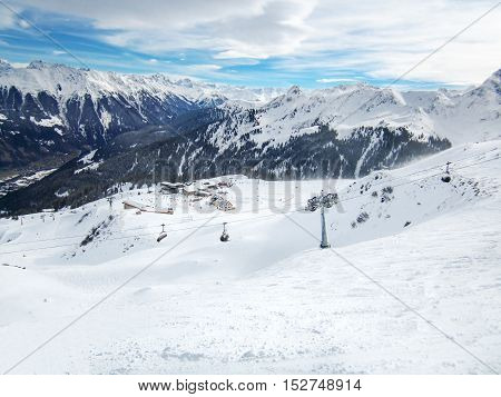 Ski slopes with chairlifts in the Golm ski resort with Montafon valley in the background, Voralberg, Austria