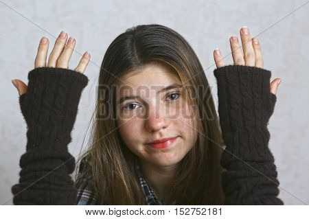 teen girl in knitted brown glows close up portrait. Teenage girl with long hair.