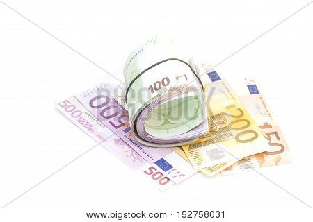 Euro banknotes under rubber band on banknotes isolated