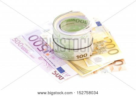 Euro banknotes under rubber band on banknotes isolated
