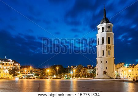 Vilnius, Lithuania. Night Or Evening View Of Bell Tower Near Cathedral At The Cathedral Square. Blue Cloudy Sky Background. Travel In Lithuania. Copyspace