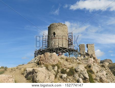 ruins of ancient tower on top of a mountain
