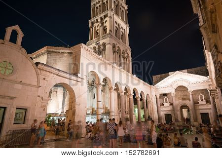 Split, Croatia - July 20, 2016: a lot of people at the peristyle in the Diocletian Palace at night