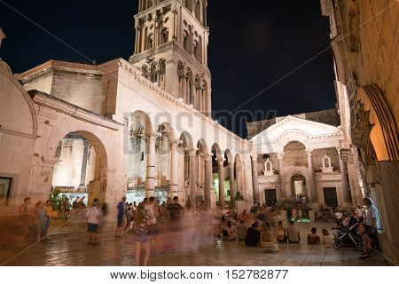 Split, Croatia - July 20, 2016: a lot of people at the peristyle in the Diocletian Palace at night
