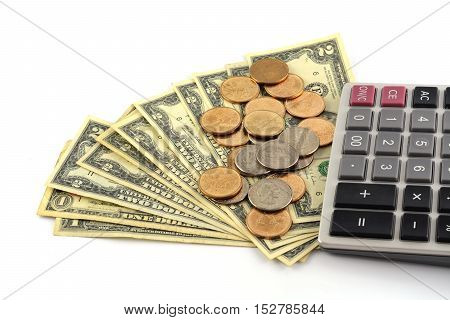 Coins On Dollars With Caculator On White Background .