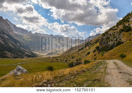 Gravel road through a beautiful valley in the Pyrenees moutnain