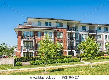 Brand new low rise apartment building on sunny day in British Columbia Canada