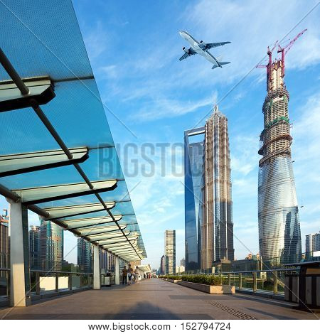 China Shanghai Lujiazui skyscrapers and sky planes.