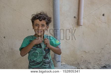 Wakan village Oman October 15th 2016: omani boy smiling