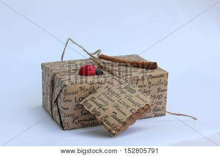 beautiful and a not great gift tied with a rope in a bow on white isolated background