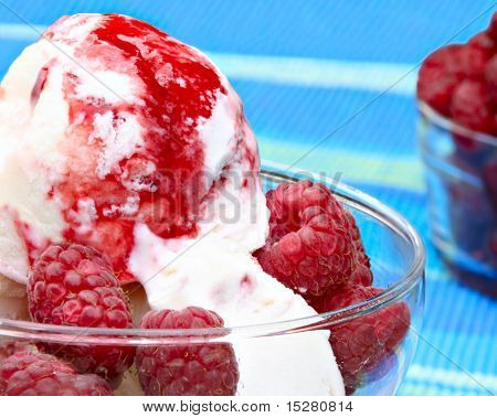 Raspberry ice cream with fresh raspberries.