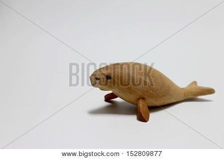 Sculptured Wood Of The Extinct Steller's Sea Cow Isolate On White Background.