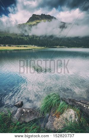 Amazing sunny day at Champferersee lake in the Swiss Alps. Silvaplana village, Switzerland, Europe, toned like Instagram filter
