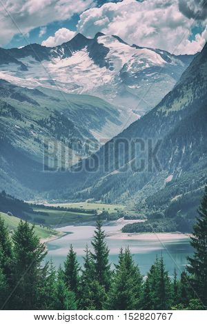 Amazing summer morning on the fantastic Speicher Durlassboden lake. Alps, Austria, Europe, toned like Instagram filter