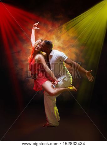 Young and sexy couple dances Caribbean Salsa