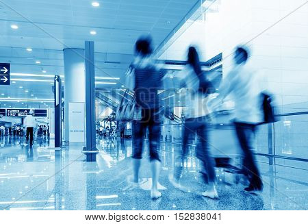 Passengers in the airport terminal motion blur movement.