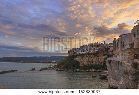 Gargano coast: bay of Vieste.-(Apulia) ITALY-Panoramic view of the old city at sunset.