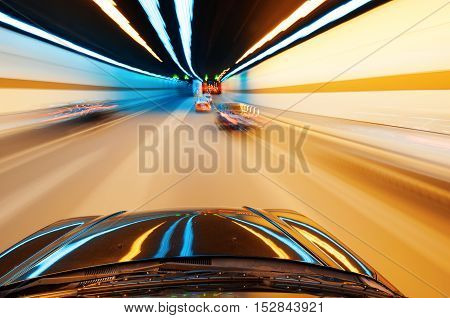 A car driving on a motorway at high speeds overtaking other cars