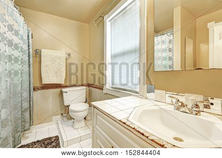 Old Style Bathroom Interior With White Tile Floor