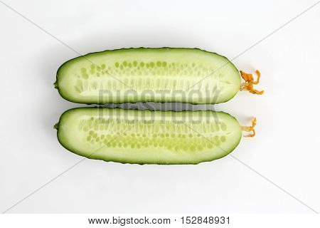 cut lengthwise the cucumber on the white background