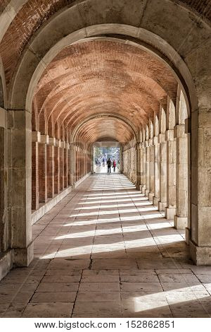 Aranjuez Spain - October 16 2016: Arches and passageway at the Palacio Real Aranjuez located in the Royal Site and town of Aranjuez Madrid province Spain