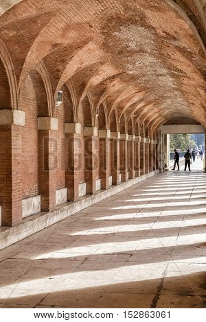 Aranjuez Spain - October 16 2016: Arches and passageway at the Palacio Real Aranjuez located in the Royal Site and town of Aranjuez Madrid province Spain