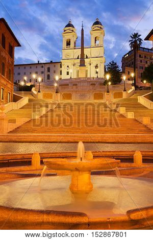 Spanish Steps with boat fountain illuminated at night, Rome, Italy