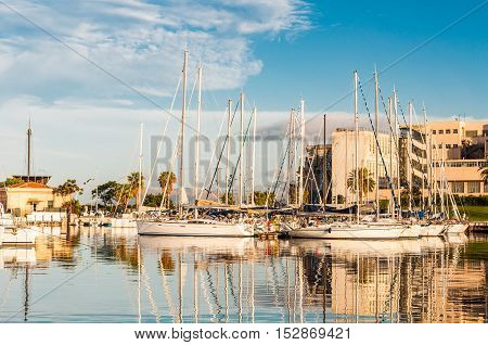 PALERMO ITALY - SEPTEMBER 9 2015: Boats and yachts parked in La Cala bay old port in Palermo Sicily Italy.