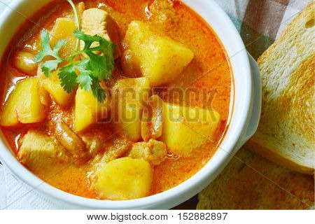 Chicken Mussaman Curry (Thai food menu) with toast.