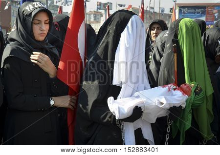 Istanbul Turkey - October 11 2016: Muslims worldwide marks Ashura Istanbul Shiite community. Turkish Shia Muslims mourning for Imam Hussain. Caferis take part in a mourning procession marking the day of Ashura in Istanbul's Kucukcekmece district Turkey on