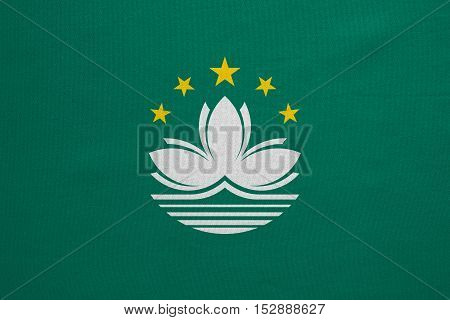 Macanese official flag. Patriotic chinese symbol banner element background. Macau is special region of PRC. Correct colors. Flag of Macau real detailed fabric texture accurate size illustration