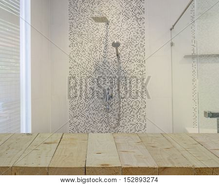 wood table top on blur of bath box in bathroom for wet zone - can use to display or montage on product
