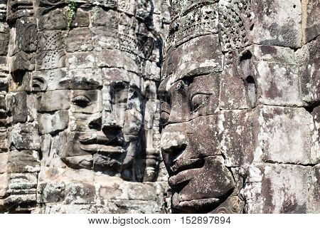 Smiling, gargantuan face at Angkor Thom, Siem Reap, Cambodia.