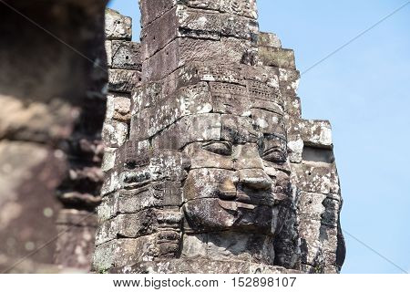 Smiling, gargantuan face at Angkor Thom, Siem Reap, Cambodia.