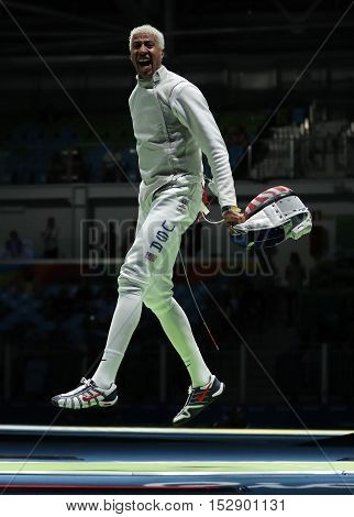 RIO DE JANEIRO, BRAZIL - AUGUST 12, 2016: Fencer Miles Chamley-Watson of United States competes in the Men's team foil of the Rio 2016 Olympic Games at the Carioca Arena 3