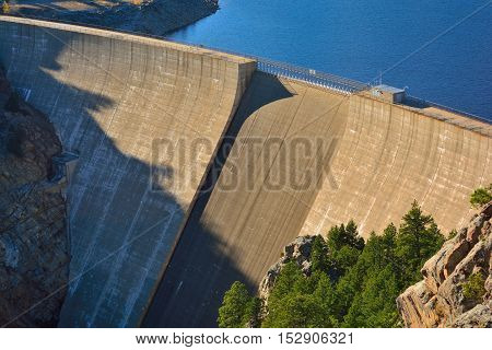 Large Concrete Dam and Reservoir on a Sunny Day