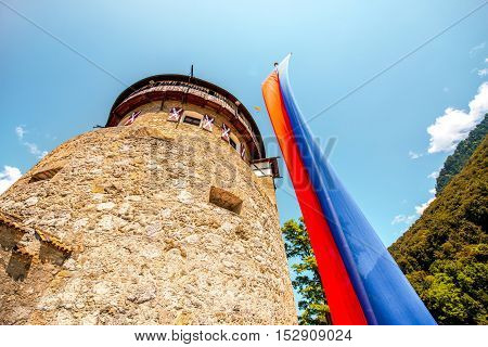 Vaduz, Liechtenstein - July 01, 2016: View on the tower with flag in Vaduz castle in the capital of Liechtenstein. This castle is the palace and official residence of the Prince of Liechtenstein