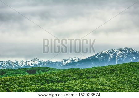 Photo of Snow-covered Carpathian Mountains Behind the Hills