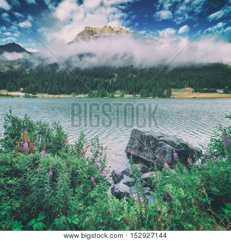 Amazing sunny day at Champferersee lake in the Swiss Alps. Silvaplana village, Switzerland, Europe. Toned like Instagram filter