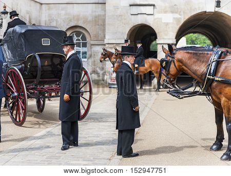 London, the UK - May 2016: Coachmen in the Whitehall yard