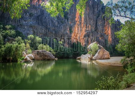 The Leonard River carves its way through the vertical walled Windjana gorge though the Napier Range which is an ancient barrier coral reef similar to the present day Great Barrier Reef but now hundreds of kilometres from the sea 