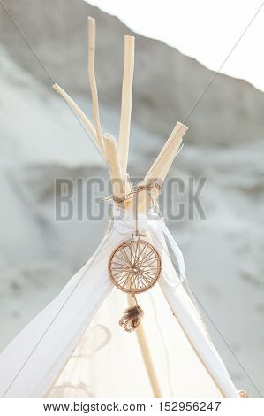 Indian tent. Dreamcatcher on white tent. Hunter of dreams. White tent.