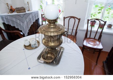 Old russian interior. Rural interior. Rural tenor of life. Old Russian furniture of kitchen. Rural furniture of kitchen. An interior of kitchen in the village.