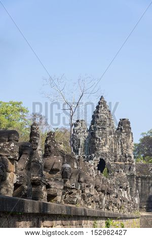 Gate guardians The entrance to Angkor ThomUNESCO heritage site Angkor Historical Park Cambodia