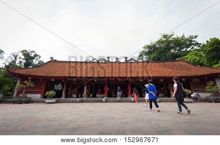 Hanoi Vietnam - September 20 2016: People walking into temple of literature or Van Mieu - Quoc Tu Giam the first university in Vietnam