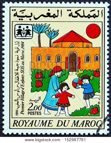 MOROCCO - CIRCA 1985: A stamp printed in Morocco issued for the 1st Moroccan S.O.S. Children's Village shows SOS Children Village, circa 1985.