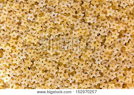 Stelle (Star shaped) pasta texture as background image