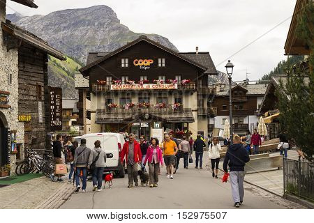 Livigno, Italy - August 1: Tourists Shopping On The Streets Of Duty-free Area On 1 August 2016 In Li