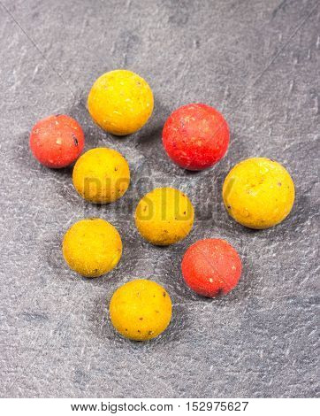 Carp Hook Boilies on black background .