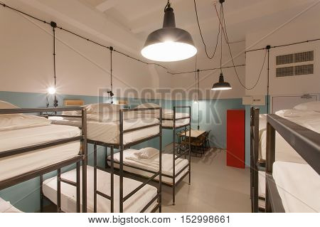 TBILISI, GEORGIA - OCT 8, 2016: Hostel bedroom interior with clean beds inside a dorm for lonely young tourists on 8 October, 2016. The annual number of tourists in Georgia reached 2300000 people